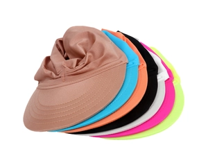 Stack of multi-colored breathable sun hats for kids showing vibrant fabric textures