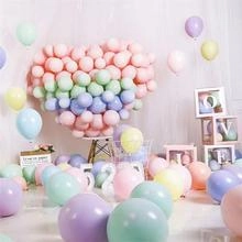 Macro view of pastel macaron latex balloons arranged for a heart-shaped party decor