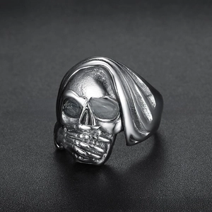 Macro shot of vintage silver skull ring with oxidized finish and gothic 3D details
