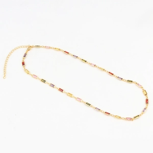 Detail of gold-plated chain with colorful rectangular cubic zirconia and lobster clasp