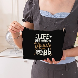 Black canvas cosmetic bag with ukulele theme print and silver zipper for storage