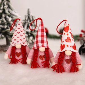 Three Valentine pink gnomes with red hearts and glowing lights for festive decor