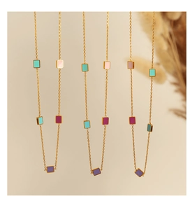 Detail of 18K gold-plated titanium chain with colorful enamel rectangle pendants