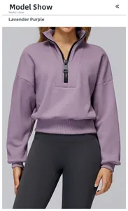 Detail of taro purple sweatshirt with black quarter-zip, drop shoulder and ribbed cuffs