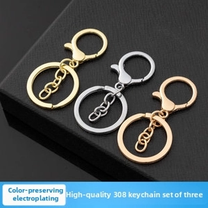 Detailed view of lobster clasp keychains in gold, silver, and rose gold plating