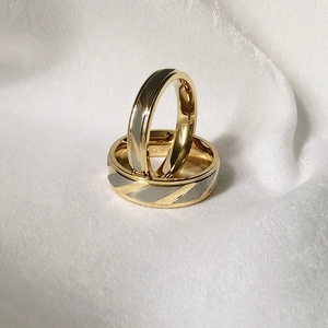 Minimalist gold and silver titanium steel couple rings with elegant diagonal brushed texture