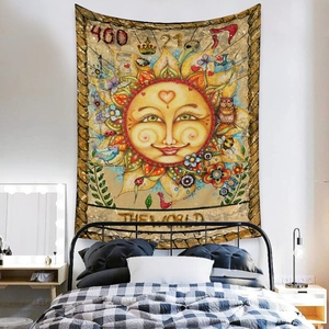 Detail of bohemian sun tarot tapestry with owls and nature motifs on a bedroom wall