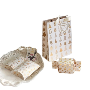 White and gold Christmas gift boxes and bags set with Merry Christmas tags on a white background