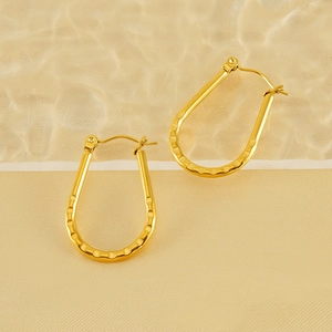 Hammered 18K gold-plated stainless steel U-shaped hoop earrings with a metallic texture