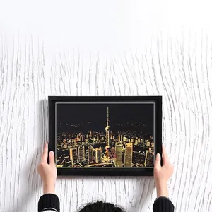 Minimalist black slim frame featuring a golden city night scene scratch art decoration
