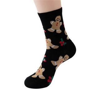 Festive black cotton Christmas crew socks featuring gingerbread man and holly berry patterns