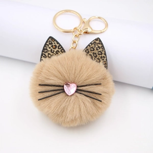 Leopard print plush cat head keychain with pink sequin heart and gold metal ring
