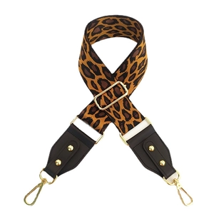 Adjustable leopard print wide shoulder strap with gold hardware and leather ends