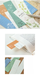 Detail showing embossed floral paper bookmarks with vintage letterpress textures