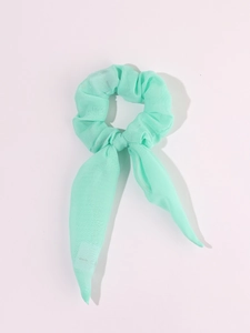 Detail of mint green LED hair scrunchie with bow ribbon in light chiffon fabric