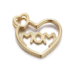 Macro shot of gold heart pendant with MOM engraving and polished metal finish