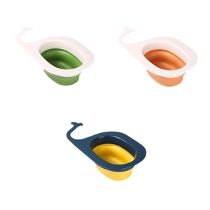 Whale-shaped sink drain baskets in three colors with hooks for kitchen organization