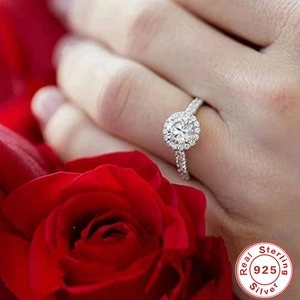 Luxury 925 sterling silver halo engagement ring with round cubic zirconia on finger
