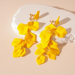 Detail of yellow acrylic petal long tassel earrings with adjustable screw-on ear clips