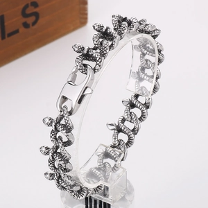 Close-up of vintage snake head bracelet with detailed scales and lobster clasp