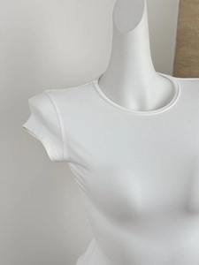 Close-up of a white slim fit short sleeve T-shirt with a round neck and soft texture