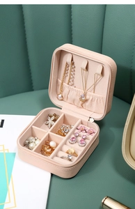 Pink portable PU leather jewelry box organizer with necklace hooks and ring storage slots