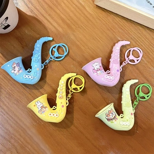 Creative saxophone shaped keychains in four bright colors featuring cute cartoon animal designs