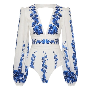 Detail of V-neck long sleeve swimsuit with blue floral print and open back design