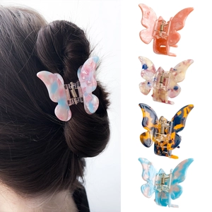 Set of five colorful butterfly hair claws in acetate marble and tortoiseshell patterns