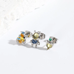 Cute space-themed astronaut, robot and rocket stud earrings with yellow cubic zirconia