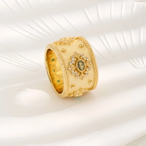Luxurious gold textured sunflower ring with oval green emerald and zircon accents