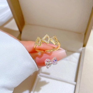 Adjustable gold ginkgo skirt ring with sparkling pavé zircons and geometric triangle design