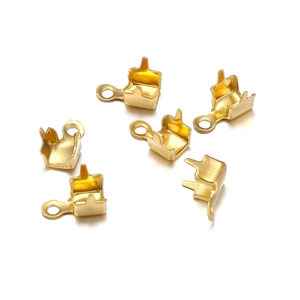 Macro view of 18k gold-plated stainless steel jewelry connectors and lobster clasps