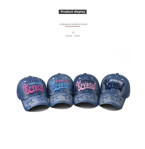 Detail display of four washed denim baseball caps with Krystal embroidery and star patterns