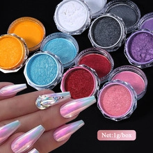 Macro shot of colorful pearlescent nail powder jars with long iridescent manicure display