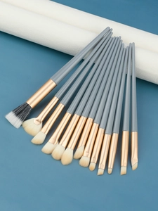 Macro detail of 13 professional makeup brushes set with blue handles and soft bristles