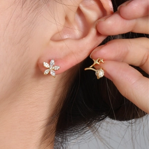 Elegant gold flower stud earrings with sparkling cubic zirconia for women