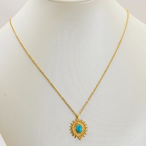 18k gold plated stainless steel necklace with turquoise pendant on jewelry mannequin