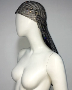 Detail of luxury black mesh headwrap with colorful rhinestones on a mannequin