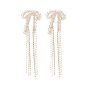 Elegant silver bow earrings with sparkling rhinestones and dangling tassels on white base