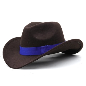 Detailed texture of brown felt cowboy hat with vibrant blue ribbon band accent