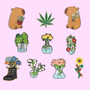 Set of 10 cute capybara and plant enamel pins with botanical laboratory designs