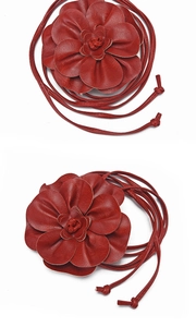 Detail of red PU leather floral waist ropes with 3D petals and long bohemian tie straps