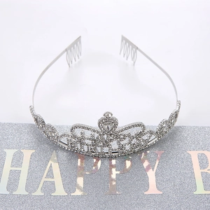 Close-up of silver birthday tiara with sparkling rhinestones and HAPPY lettering