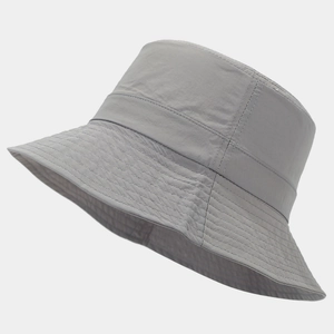 Detail of grey quick-dry bucket hat showing durable nylon fabric and reinforced brim stitching