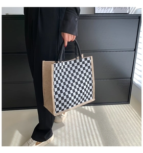 Detailed view of checkered linen tote bag with reinforced burlap edges and sturdy handle