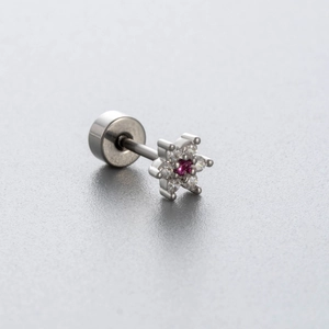 Star-shaped silver piercing earring with a pink center gemstone and clear zircon accents