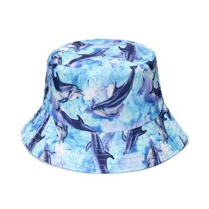 Light blue bucket hat featuring watercolor dolphin ocean prints for sun protection