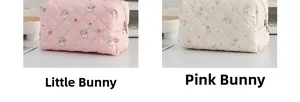 Detailed view of quilted cotton cosmetic bags with cute rabbit patterns and metal zippers