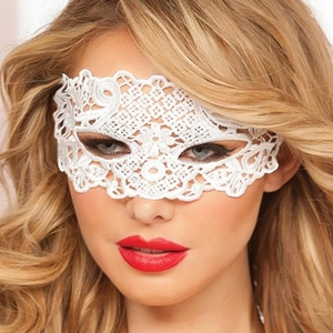 Detailed close-up of a white intricate lace masquerade eye mask worn by a model